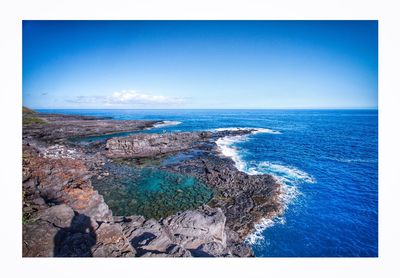 Scenic view of sea against clear blue sky