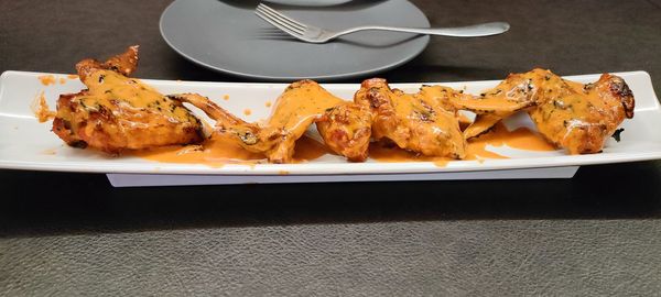 Close-up of wings on a table
