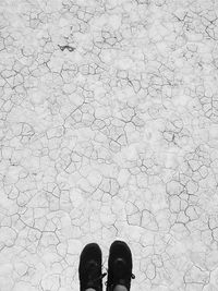 Low section of man standing on floor