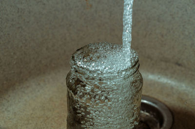 High angle view of wet glass on table