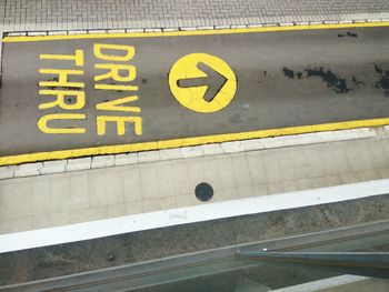 High angle view of arrow sign on road