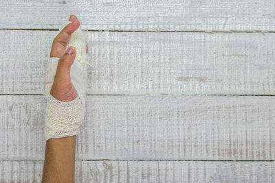 Directly above shot of woman hand on wall