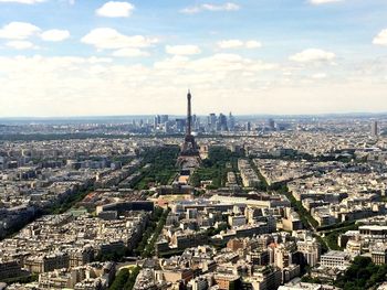 Cityscape against cloudy sky