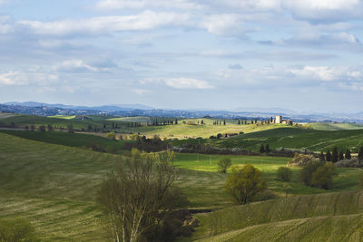 Scenic view of landscape against cloudy sky