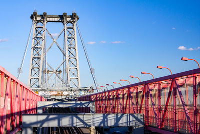 Low angle view of bridge against blue sky