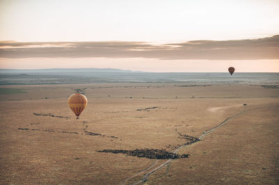 Hot air balloon flying over land