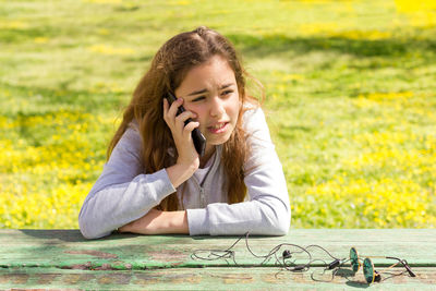 Mid adult woman using mobile phone