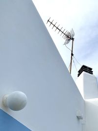 Low angle view of communications tower against sky