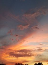 Low angle view of dramatic sky during sunset