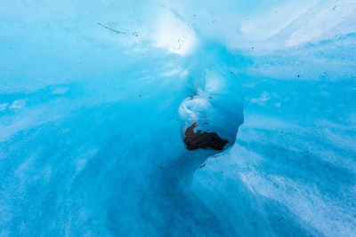 Low angle view of ice formation against cloudy sky