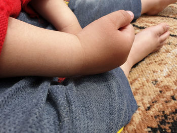 Low section of woman sitting on floor