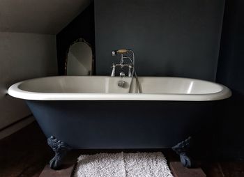 Close-up of bathtub in bathroom at home