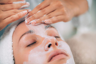 Close-up of woman getting massage therapy at spa