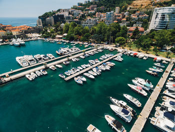 High angle view of boats moored at harbor