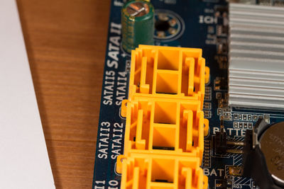 High angle view of yellow machine on table