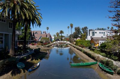 Panoramic view of houses and trees against clear sky