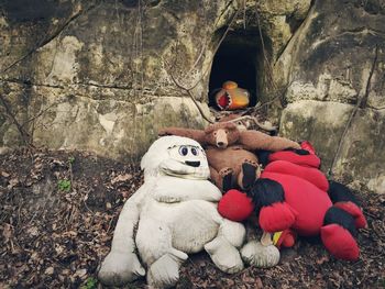 Close-up of stuffed toys against the wall