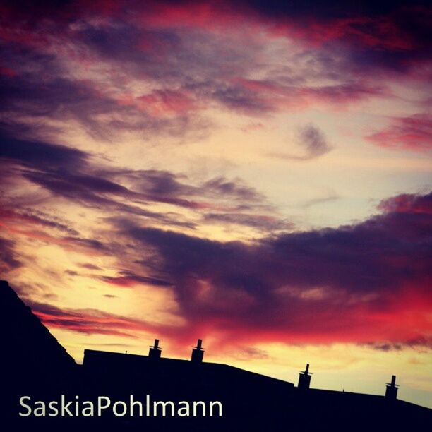 sunset, sky, cloud - sky, low angle view, text, communication, silhouette, cloudy, orange color, western script, built structure, architecture, cloud, guidance, building exterior, dramatic sky, dusk, high section, outdoors, sign