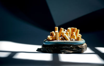 Close-up of cigarette on table