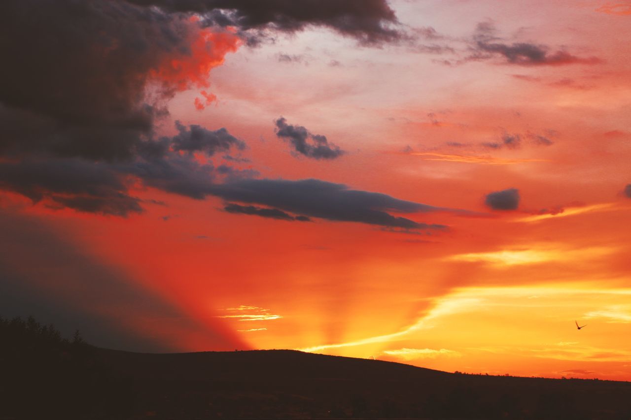 sky, cloud, sunset, beauty in nature, afterglow, orange color, red sky at morning, scenics - nature, dramatic sky, environment, nature, mountain, landscape, silhouette, tranquility, no people, tranquil scene, dawn, outdoors, land, idyllic, red, non-urban scene, sun, atmospheric mood, awe, evening, sunlight, travel destinations, moody sky, yellow
