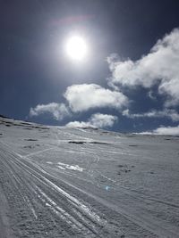 Scenic view of snow covered landscape against sky