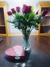 Close-up of tulips in vase on table at home