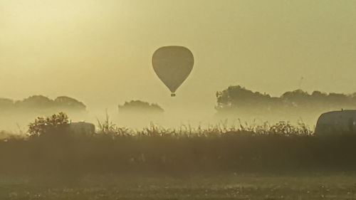 Silhouette of hot air balloon against clear sky