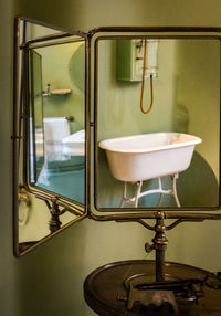 Close-up of faucet in bathroom
