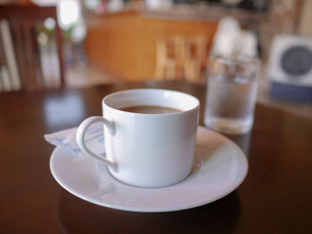 Close-up of coffee cup on table