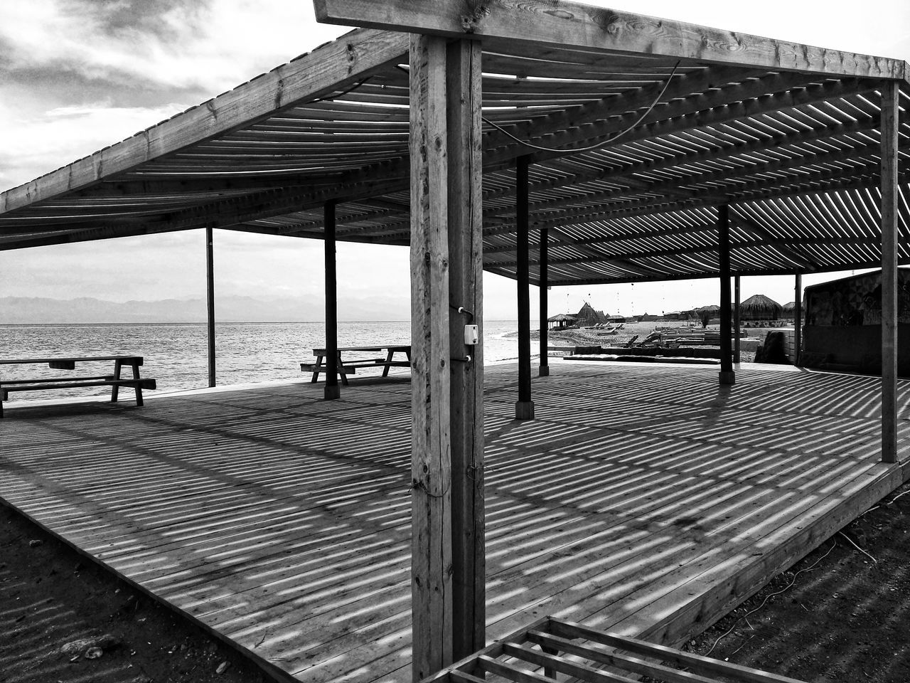 built structure, architecture, water, day, outdoors, sky, sea, roof, beach, nature, underneath, no people, under