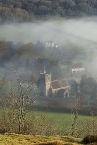 View of historic building on field against sky
