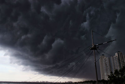 Low angle view of wind turbine against sky