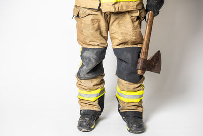 Low section of person standing against white background