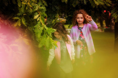 Portrait of smiling girl with plants