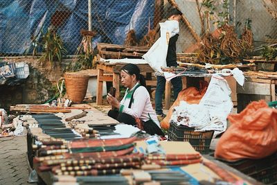 People working at market stall