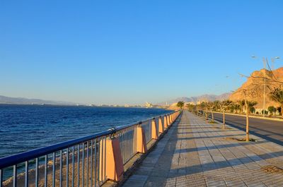 Scenic view of sea against clear blue sky