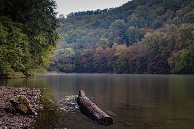 Scenic view of lake with mountains in background