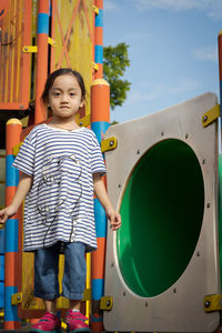 Little girl playing at the playground.