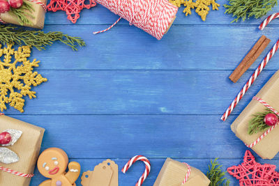 Christmas decoration full borders on blue wooden table with copy space. christmas background