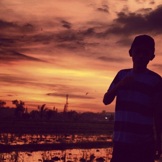 sunset, silhouette, sky, water, orange color, cloud - sky, scenics, tranquility, lake, beauty in nature, tranquil scene, reflection, nature, cloud, idyllic, river, men, lifestyles