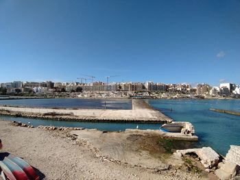 Scenic view of sea against clear blue sky