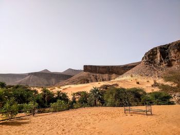 Scenic view of desert against clear sky