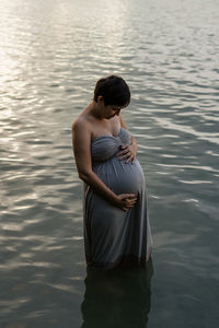 Woman standing in lake