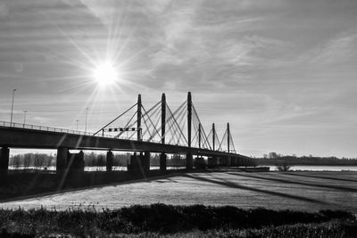 Bridge over river against sky