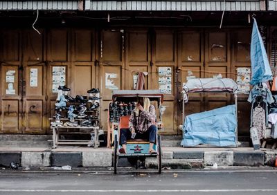 People working on street in city