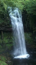Scenic view of waterfall in forest