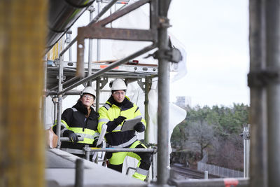 Engineers talking at building site