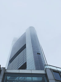 Low angle view of modern building against clear sky