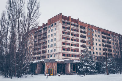 Buildings against sky during winter