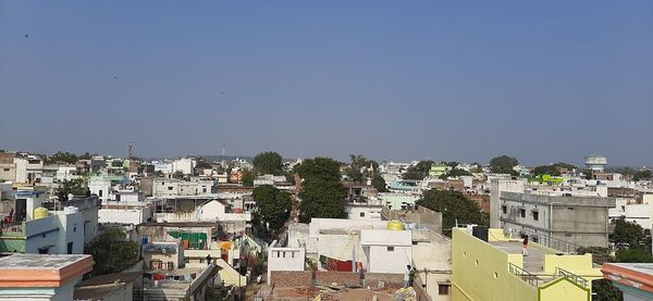 Aerial view of townscape against clear sky